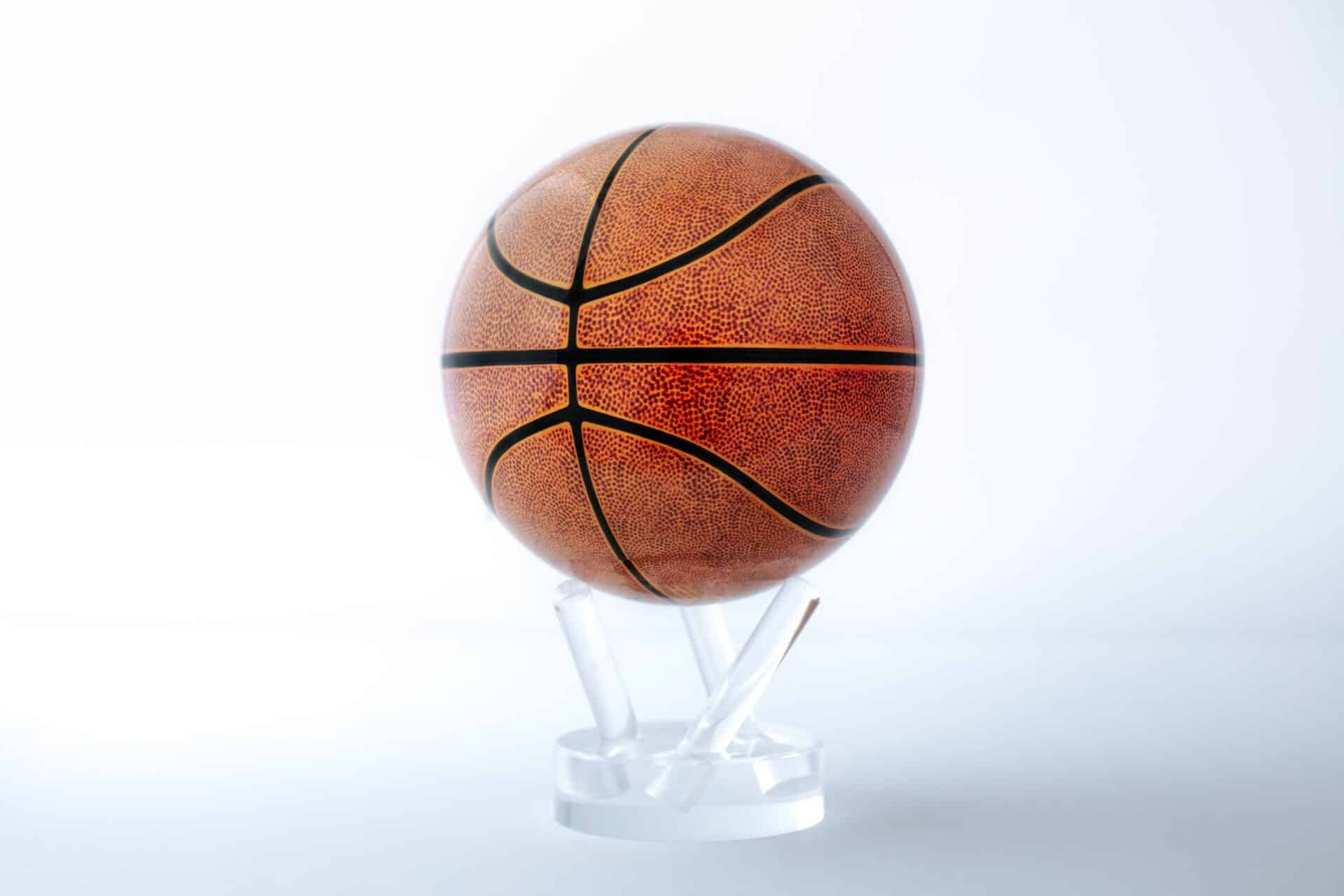 Children playing globe basketball