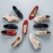 A stylish collection of fashionable wide width shoes, including colorful heels, chic ankle boots, and comfortable sneakers, arranged on a bright, clean background.