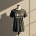 A person wearing a white t-shirt with the black text "stop copying me shirt" standing against a neutral background.