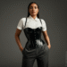 A person wearing a sleek black underbust latex corset over a white blouse, showcasing its waist-cinching effect.