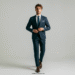 A man looking sharp and confident in a perfectly tailored navy suit blue with a white shirt and brown leather shoes.