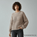 A stylish person wearing a cozy, well-fitted grey ie jumper against a neutral background.